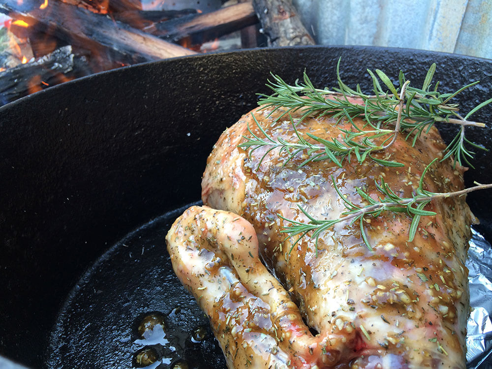 this photo depicts a camp oven roast lamb ready to be cooked.